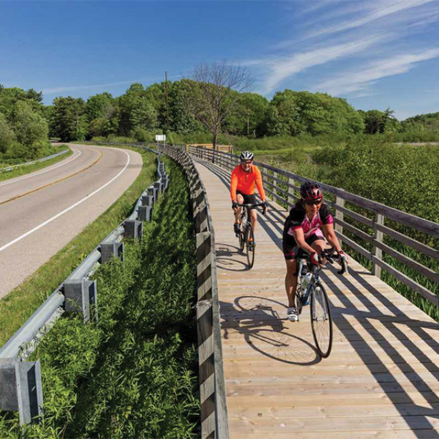 Bikers enjoying separated bike paths in Holland, Michigan