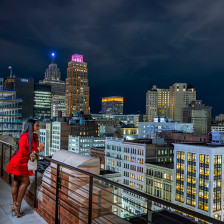 Customer of Monarch Club on a balcony overlooking downtown Detroit, Michigan